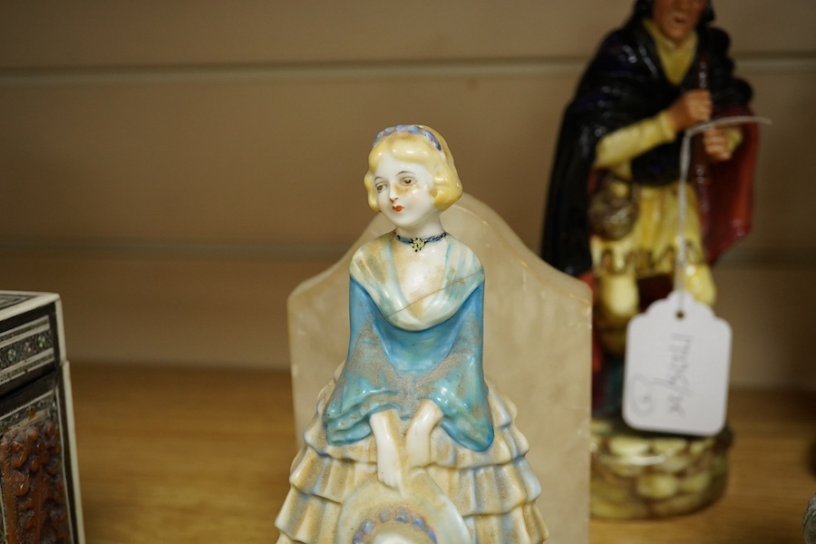 Two Royal Doulton figures comprising; The Mask Seller and Pied Piper together with three other figures and a pair of alabaster bookends, largest 24cm high. Condition - mostly fair/good